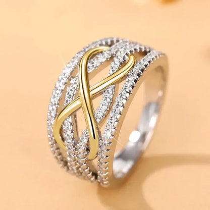 Anillo Infinito Bicolor con Zirconias Brillantes